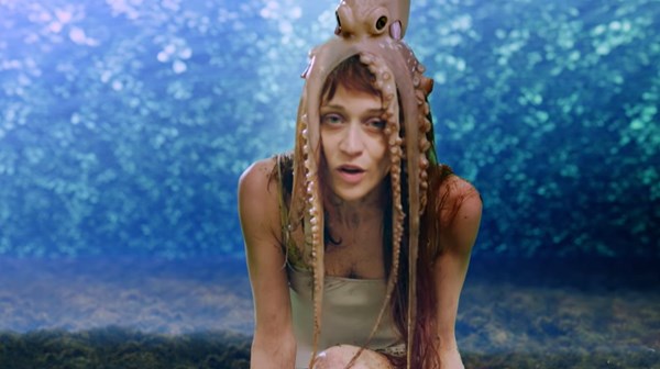 Screenshot of Fiona Apple from 'Every Single Night' video with an octopus on her head